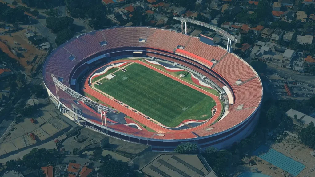 Aerial image of Estádio do Morumbi, São Paulo — a massive oval stadium surrounded by urban neighborhoods and tree-lined streets (Google Earth)